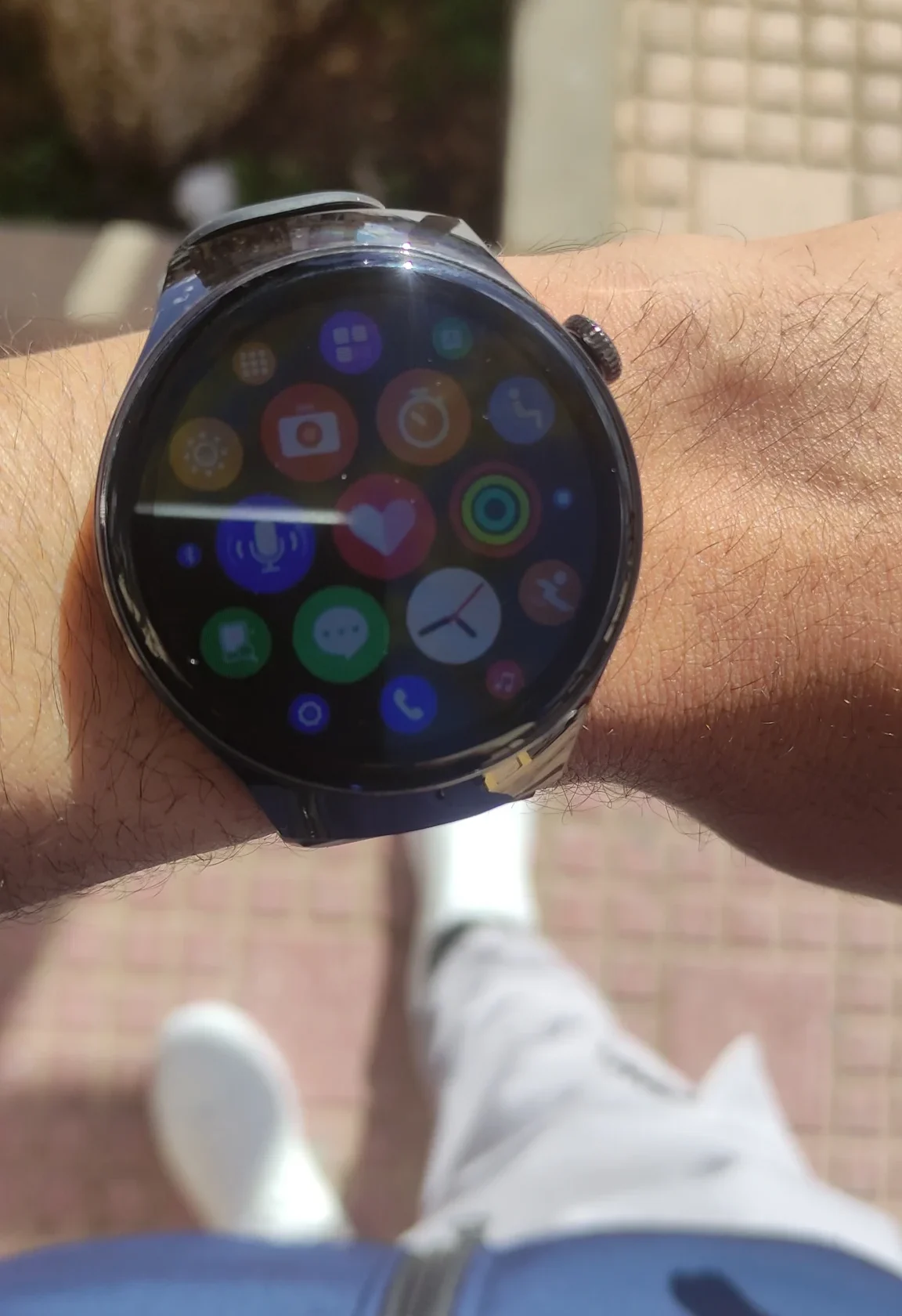 Smartwatch displaying various app icons